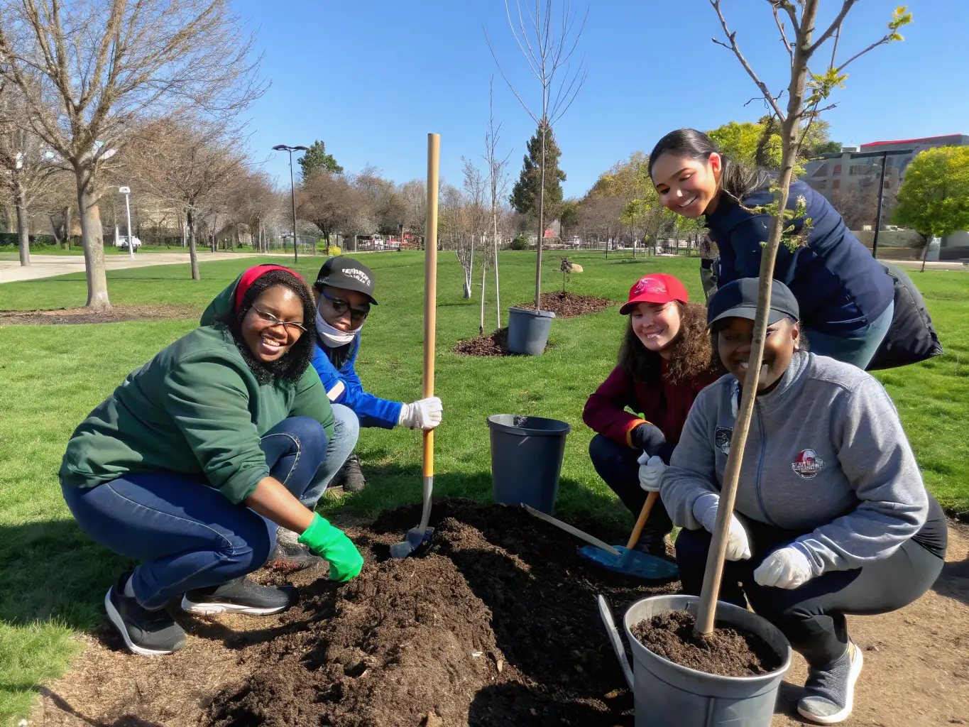 A group of volunteers planting trees in a local park, symbolizing the association's commitment to environmental conservation and community involvement.